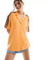 Фото #1 товара adidas Originals terry towelling resort shirt in hazy orange