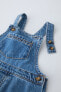 Denim dungarees with pocket