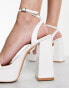 Glamorous platform heel sandals in white patent