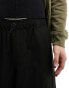 ASOS DESIGN loose fit cargo trouser with front elasticated pockets in black