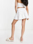 ASOS DESIGN flippy broderie mini skirt in white