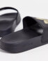 adidas Originals Adilette lite sliders in black with gold trefoil