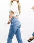 Фото #2 товара ASOS DESIGN mid rise cotton blend exaggerated flare jeans in midwash - MBLUE