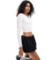 Фото #1 товара ASOS DESIGN knitted long sleeve crop top with crew neck in white