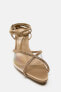 Lace-up vinyl sandals with rhinestones