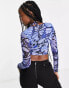 Фото #2 товара ASOS DESIGN Fuller Bust long sleeve cupped halter top in blue butterfly print