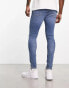 ASOS DESIGN spray on jeans with power stretch in mid wash blue