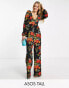 ASOS DESIGN Tall – Langärmliger Jumpsuit aus Blasenkrepp mit Blumenmuster und Knopfverschluss auf der Rückseite