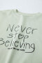 T-shirt with embroidered slogan