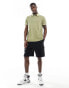 Tommy Hilfiger garment dye regular polo in olive green Зеленый, S - 45-48 - фото #2