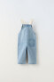 Contrast denim dungarees with buckles