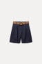 DARTED BERMUDA SHORTS WITH BELT