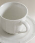 Porcelain teacup and saucer