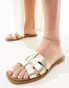 schuh Tierney flat sandals in gold leather