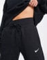 Фото #3 товара Nike mini swoosh high rise wide leg joggers in black and sail