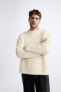 Textured cable-knit sweater