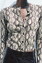 KNIT CARDIGAN WITH ANIMAL PRINT