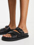 schuh Tamara cross strap flat sandals in black