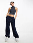 COLLUSION knitted washed cropped sleeveless vest in denim-look blue