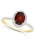 ფოტო #1 პროდუქტის Garnet (1-1/2 ct. t.w.) and Created Sapphire (1/5 ct. t.w.) Halo Ring in 10K Yellow Gold