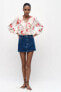 Ruffled shirt with floral print