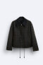 Waxed-effect check jacket