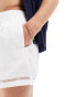 ASOS DESIGN swim shorts in short length with side hem details in white