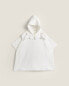 Children’s poncho with floral embroidered collar