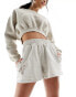 Фото #1 товара New Era script embroidery shorts in off white