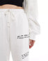 Фото #4 товара Weekday Unisex co-ord joggers with graphic embroidery in off-white exclusive at ASOS