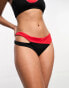 Фото #4 товара Nike Swimming Icon Sneakerkini asymmetrical bikini bottoms in black and red