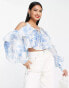 ASOS DESIGN ruffle blouse with lace up back in blue floral