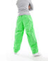 The North Face Tek woven joggers with reflective piping in bright green