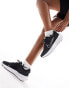 Фото #1 товара Nike Running Interact Run trainers in black and white