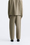 Wide-fit pleated trousers