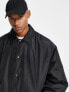 ASOS DESIGN extreme oversized shower resistant rain jacket in black