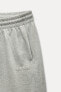 METALLIC THREAD TROUSERS WITH SLOGAN