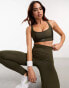 Puma Running Evolve medium support sports bra in khaki