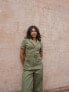 Labelrail x Pose and Repeat belted boiler suit in forest green with pink contrast stitch