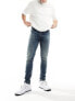 Фото #1 товара ASOS DESIGN skinny jeans with abrasions in dark wash blue