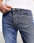 HUGO 634 distressed knees tapered fit jeans in mid blue