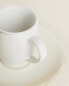 Stoneware coffee cup and saucer
