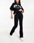 Фото #4 товара ASOS DESIGN seamless sculpting co-ord ribbed flare legging in black