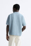 Textured polo shirt with ribbed trims