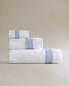 Cotton towel with pleated border