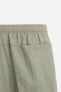 CREASED-EFFECT LONG SWIMMING TRUNKS