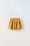 Loose-fitting textured weave bermuda shorts