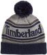 Фото #1 товара Мужская шапка серая трикотажная Timberland Men's Logo Cuffed Beanie with Pom