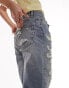 Topshop mid rise straight Dad jeans with extreme rip & repair in mid blue