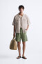 BERMUDA SHORTS WITH UNEVEN TRIMS